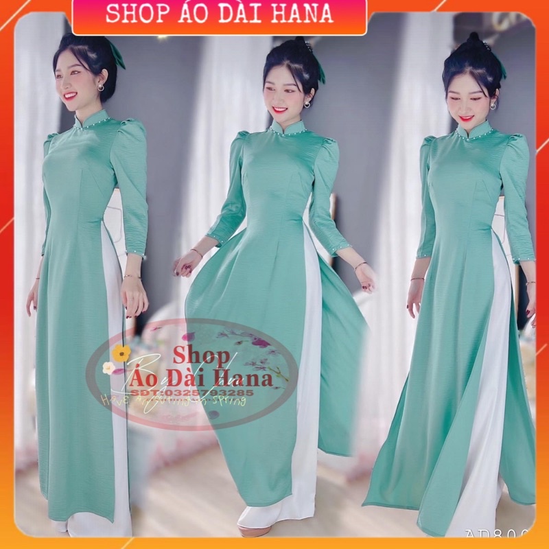 Áo dài cách tân nữ tay vai bồng, cổ truyền thống tay lỡ, áo dài trơn đính kết ngọc ở phần cổ xinh, thiết kế may sẵn.
