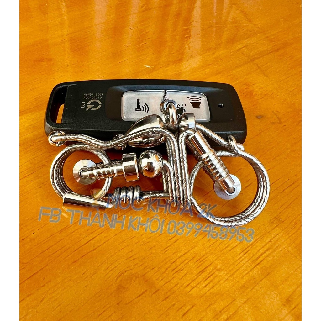 MÓC KHÓA INOX MẨU MOTO SỢI HOA VĂN
