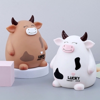 ATM piggy bank in the shape of a dairy cow for New Year's birthday gifts