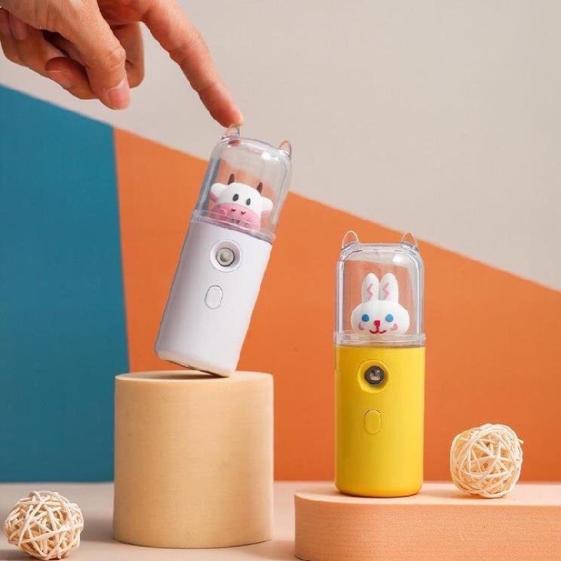 MÁY PHUN SƯƠNG XÔNG HƠI MẶT MINI CẦM TAY HÌNH BÒ SỮA CUTE/