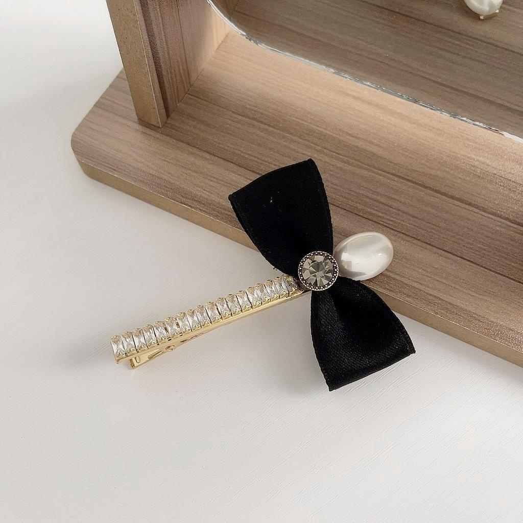 Kẹp tóc nữ hình nơ đính ngọc trai nhân tạo xinh xắn