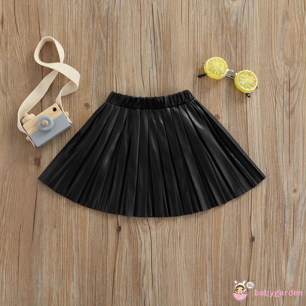 Chân váy da xếp ly lưng thun co giãn màu trơn dành cho bé gái