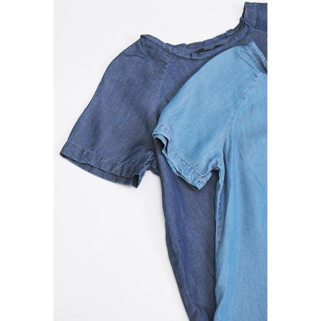 Áo denim cổ tròn 1 túi trước lệch tà Haute Monte