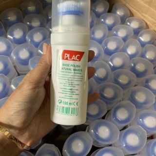 Chai tẩy trắng giày có bàn chải .