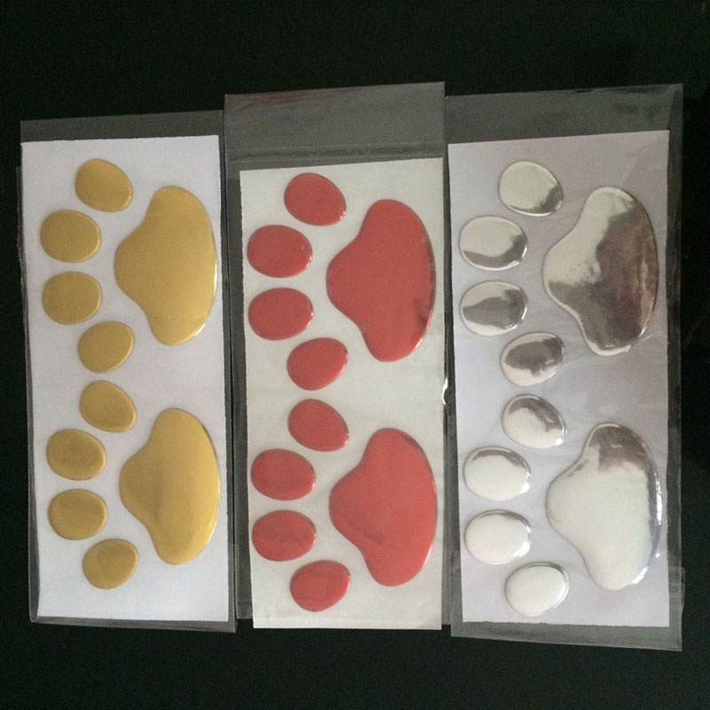 Bộ 2 Miếng Dán Trang Trí Xe Hơi Hình Dấu Chân Chó Mèo Gấu 3d Màu Vàng / Bạc