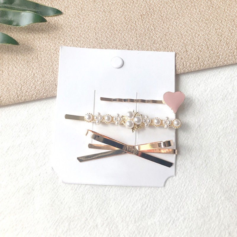 Kẹp tóc hình trái tim và ngọc trai