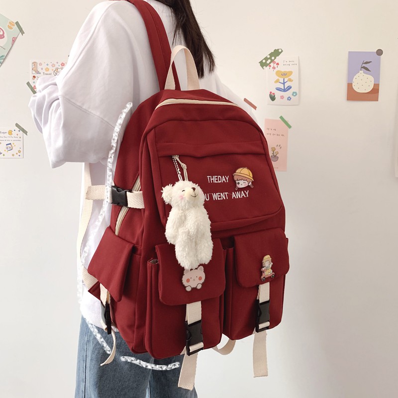 Balo The day chất vải chống thấm tặng sticker và móc khóa gấu bông