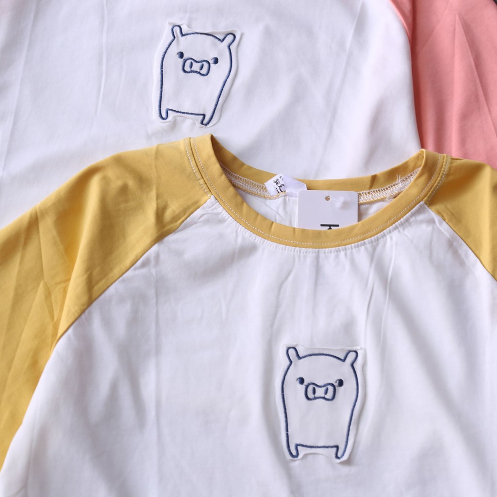 ÁO TRẮNG TAY RAGLAN HỌA TIẾT HÌNH CHÚ LỢN