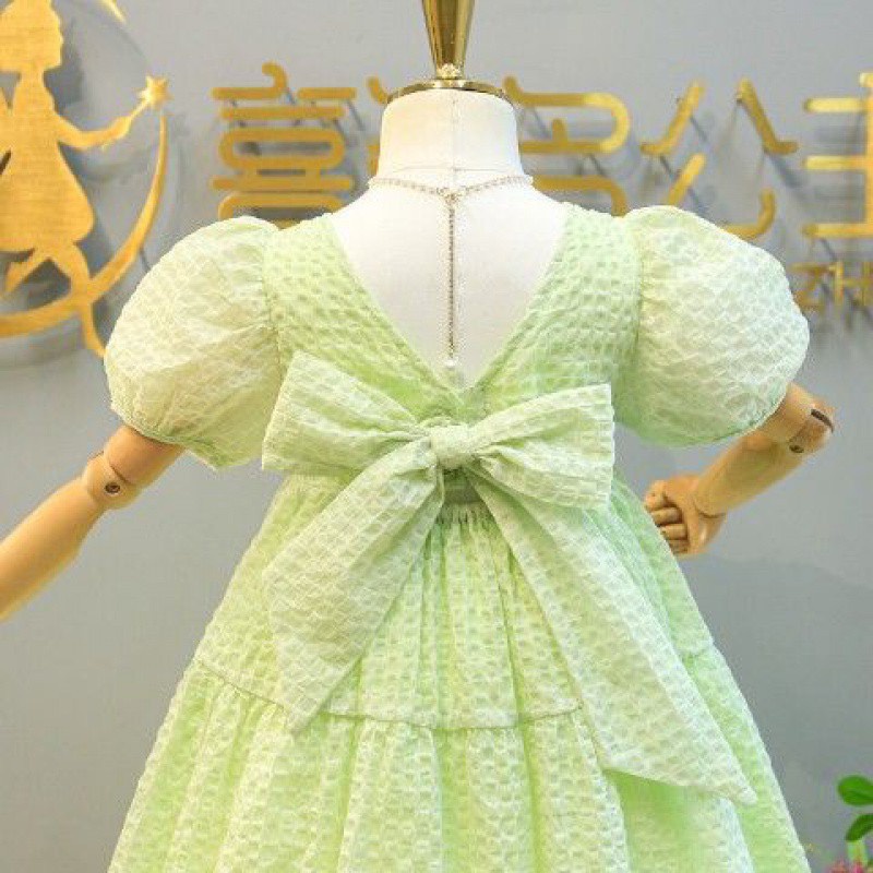 Váy bé gái xanh cốm 2 tầng nơ lưng XHN1016