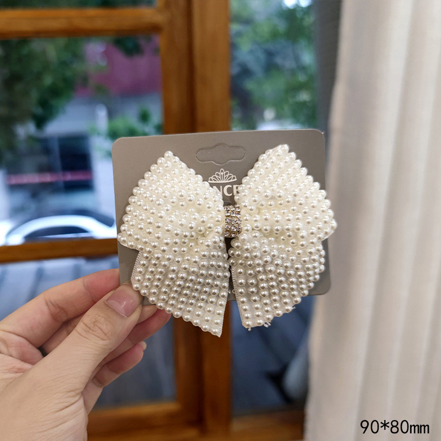 Kẹp tóc trang trí nơ nơ đính hạt ngọc trai phong cách Hàn Quốc