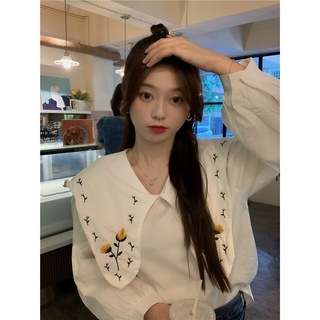 Áo chữ A vải cotton thấm hút tốt, cổ áo Peter Pan thêu hoa.