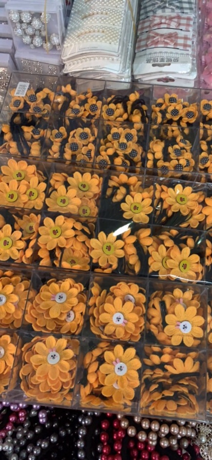 Sỉ 10 buộc tóc hình hoa len đan 53k