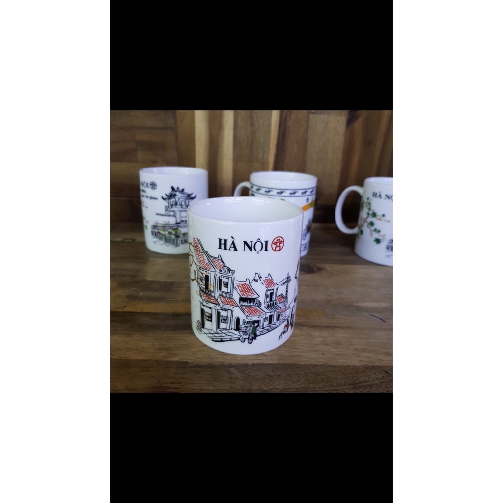 Cốc gốm sứ bát tràng In biểu tượng Hà Nội Văn Miếu cầu Thê Húc men trắng hoa văn đẹp sáng bóng an toàn tuyệt đối phố cổ