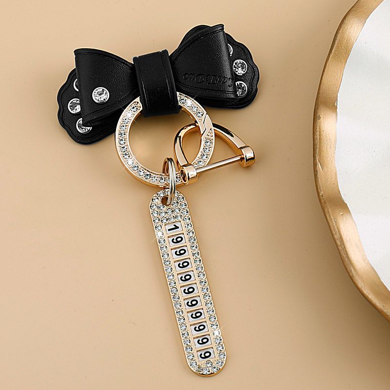 Giá Đỡ Chìa Khóa Xe Hơi / Xe Máy Hình Nơ Bằng Da Phối Kim Loại Đính Đá Vàng Dễ Thương Cho Nam Và Nữ