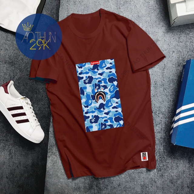 ALBUM 134 - ÁO THUN UNISEX ĐỎ ĐÔ HOẠ TIẾT RẰN RI MẮT VÀNG CÁ TÍNH | BigBuy360 - bigbuy360.vn