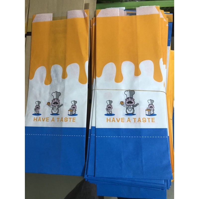 bịch 100 túi đựng bánh mì hoa cúc đầu bếp xanh vàng cỡ 12x31cm dọc bánh 250-350g