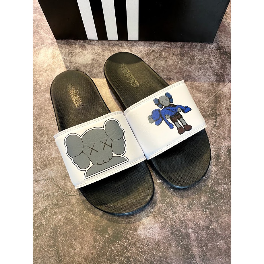 Dép adidas plus kaws đen quai trắng nam