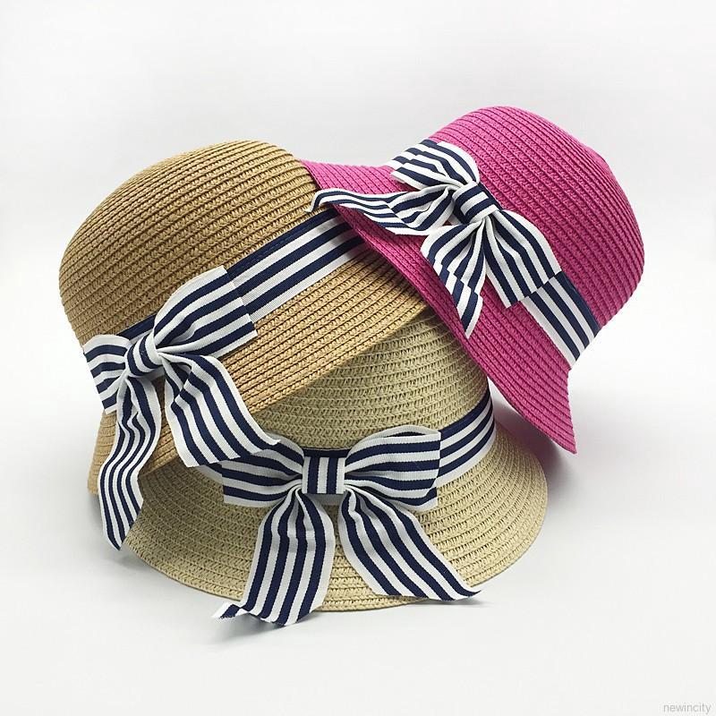 Mũ cói rộng vành đính nơ kẻ sọc đáng yêu cho bé