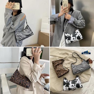 Túi kẹp nách họa tiết bò sữa