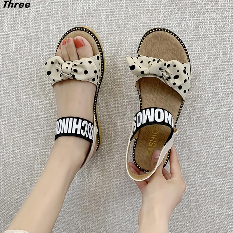 Women's shoes, sandals, fashion bow, women's all-match flat elastic band Korean version of non-slip Roman women's beach shoes