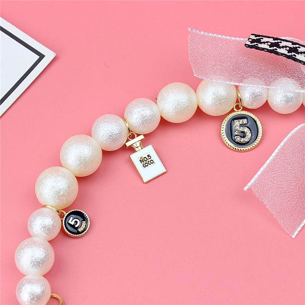 Chuỗi dây ngọc trai nhân tạo đeo cổ tay gắn điện thoại thời trang tiện dụng