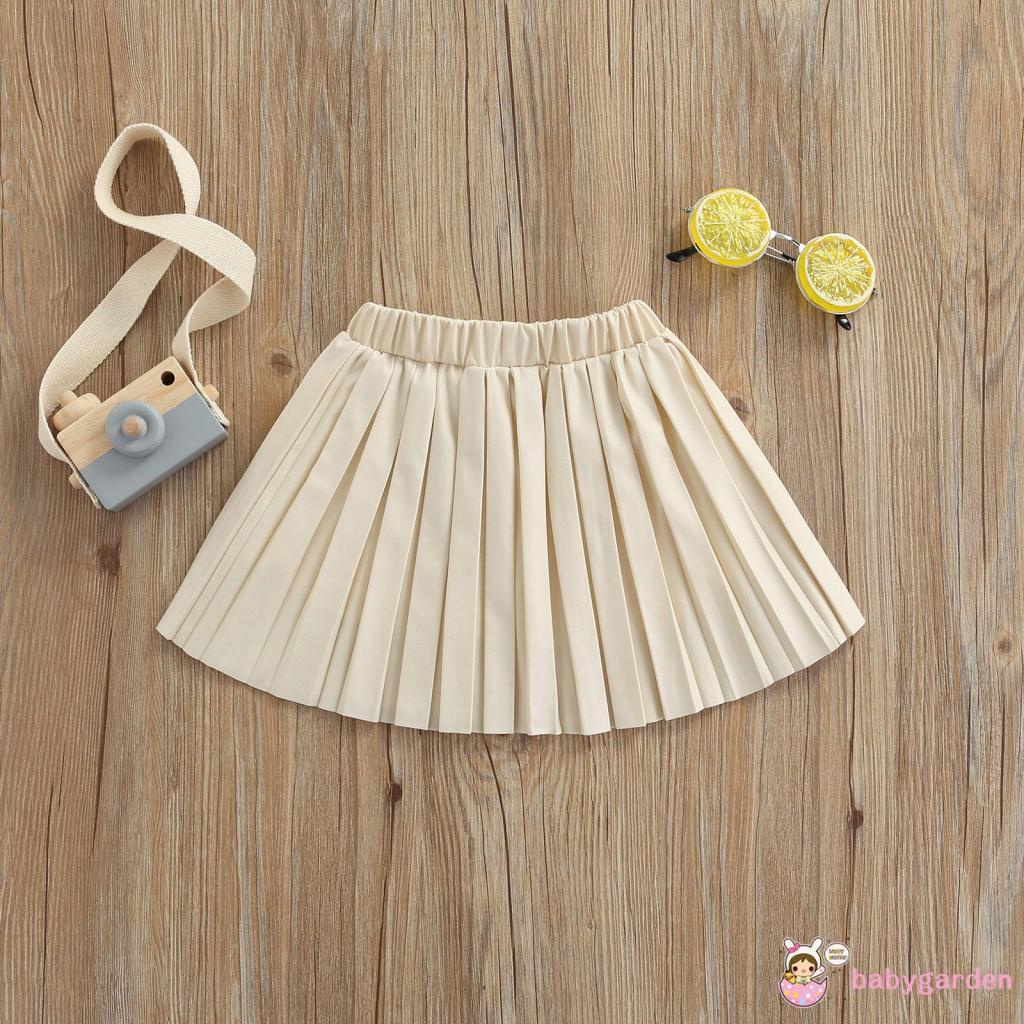 Chân váy da xếp ly lưng thun co giãn màu trơn dành cho bé gái