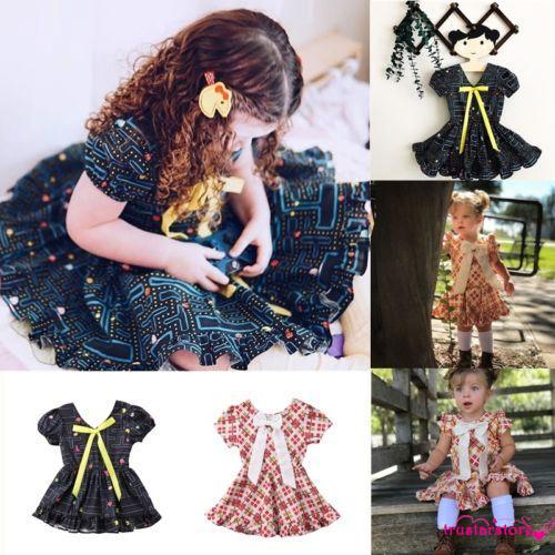 Đầm xòe tay bồng đính nơ đáng yêu cho bé gái