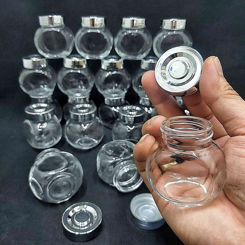 Lọ thủy tinh nhỏ 50ml (combo 24 lọ) mẫu Tròn Dẹt kiểu Nghiêng - Nắp nhựa màu bạc - Hũ đựng mỹ phẩm, thực phẩm