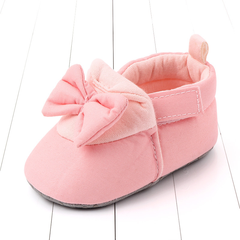 Giày tập đi đế mềm mại chống trượt đính nơ xinh xắn đáng yêu dành cho bé gái 0-12 tháng tuổi