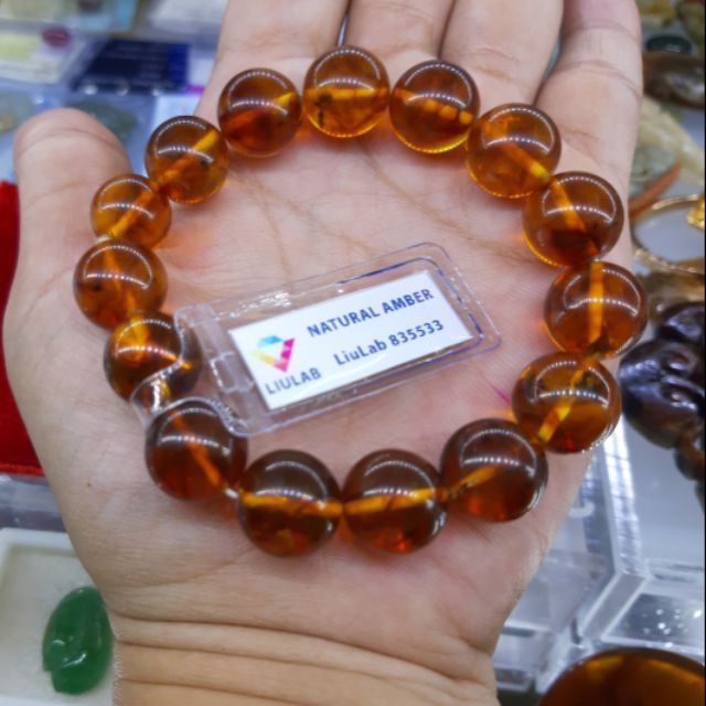 Chuỗi đeo tay nam hổ phách thiên nhiên 14 ly. Mã số giám định Liulad 835533. Màu vàng mật ong.giám định chi tiết đi kèm.