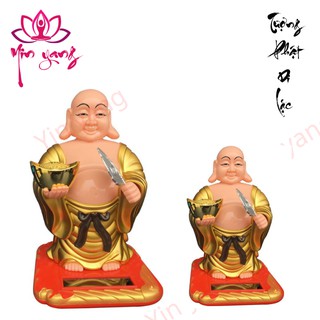 Tượng phật di lặc gật gù để ban thần tài