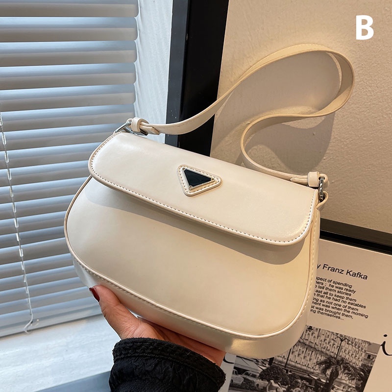 Túi xách góc bầu nắp đính tam giác