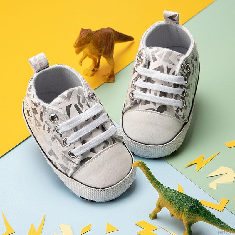 Giày Thể Thao Vải Bạt Đế Mềm Chống Trượt In Họa Tiết Graffiti Cột Dây Cho Bé Sơ Sinh 0-12 Tháng Walkers