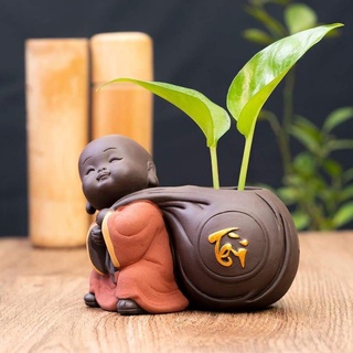 Tượng chú tiểu trồng cây phong thủy - chữ Tài