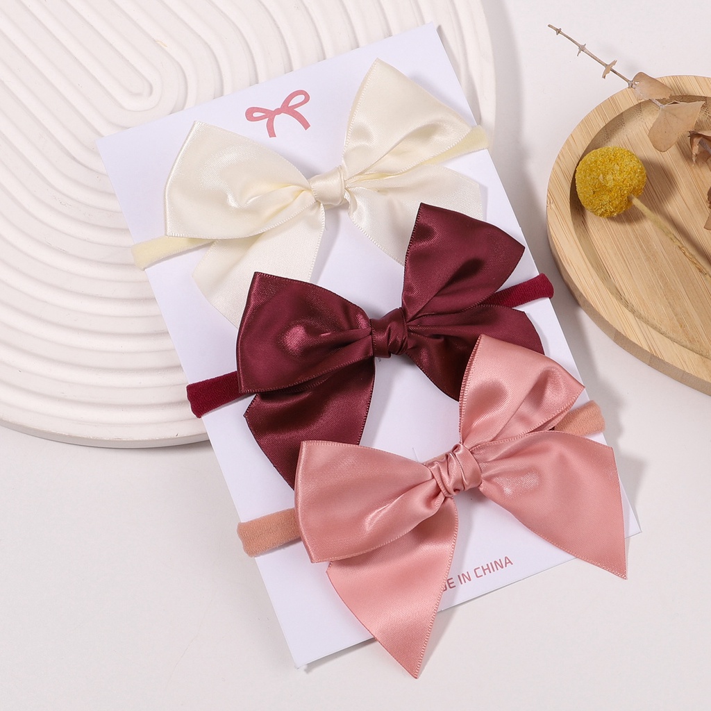 Băng đô KIDSBOWS lụa satin thắt nơ co giãn 3 màu trơn dành cho bé gái