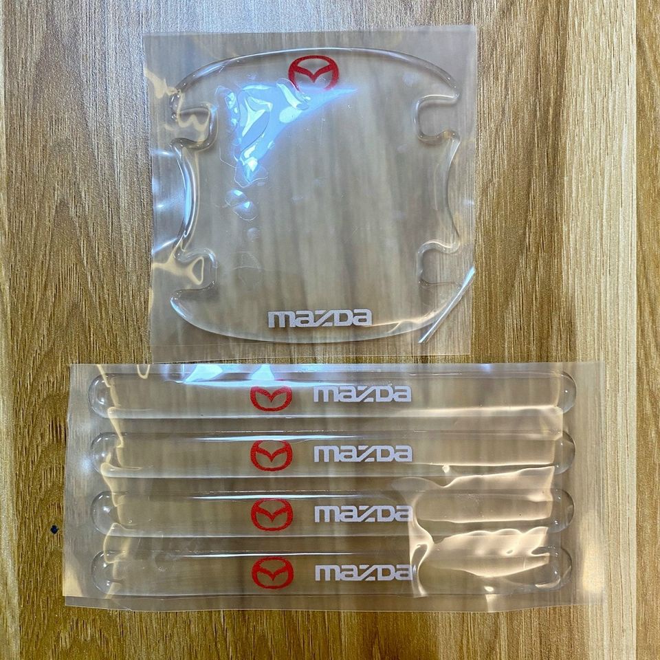 Bộ 10 miếng dán silicon tay, hõm, gương ô tô logo hãng xe Mazda 2, Mazda 3, Mazda 6, CX5, CX8, BT50, CX3, CX30