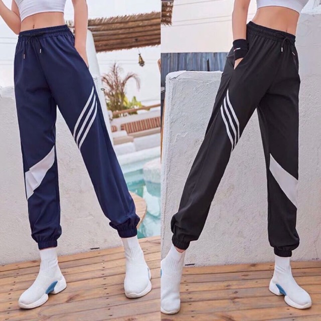 Quần jogger dù sọc đùi thể thao