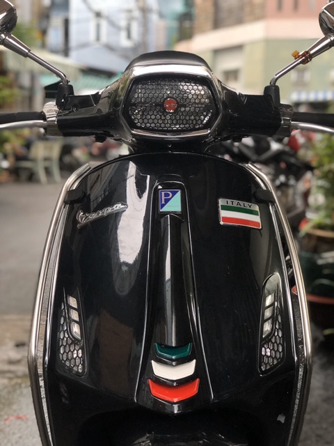 ỐP ĐÈN (CHỤP ĐÈN) PHA VESPA TẶNG KÈM LOGO CÀ VẠT