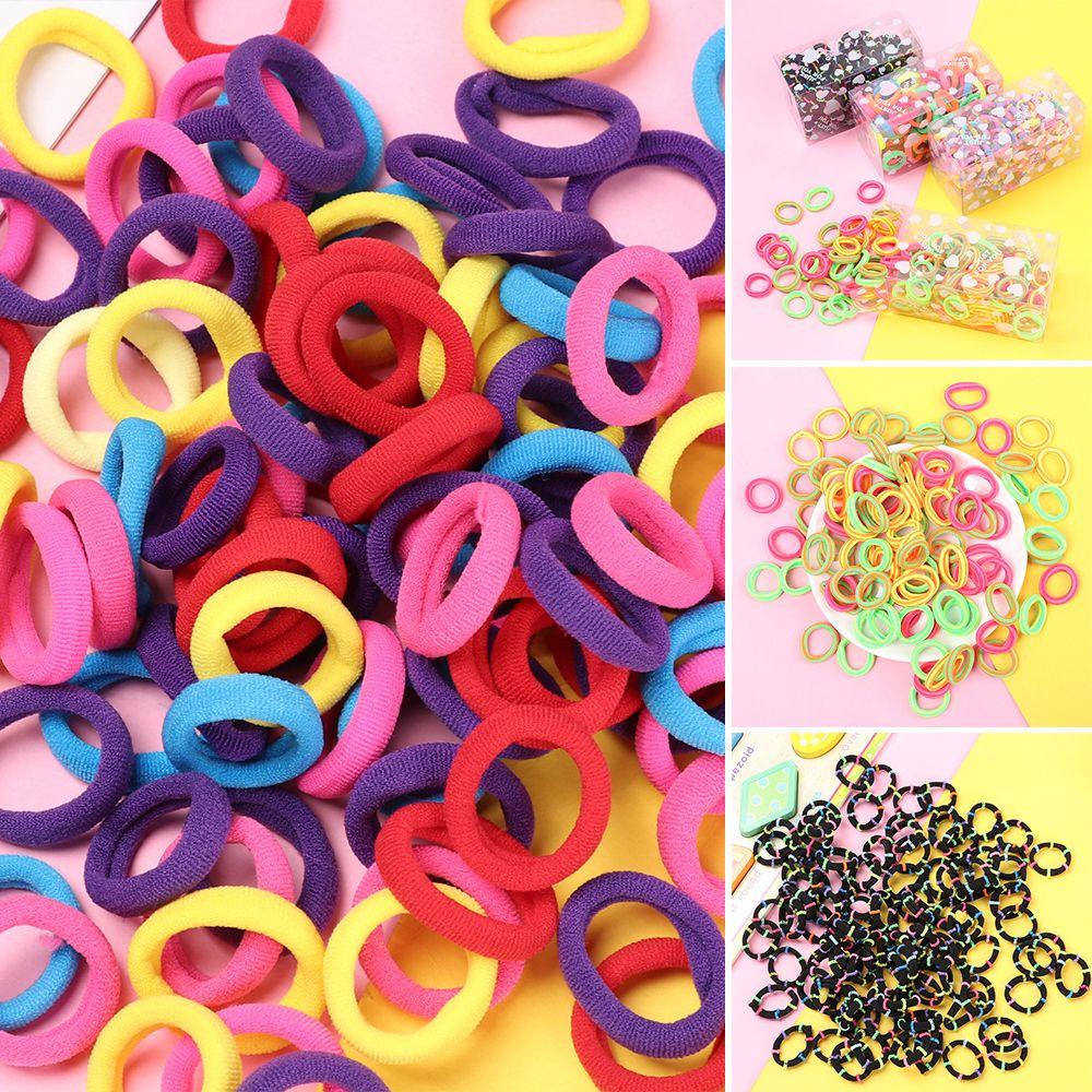 Hộp 100 Dây Thun Buộc Tóc Cao Su Mềm Nhiều Màu Sắc Cho Bé