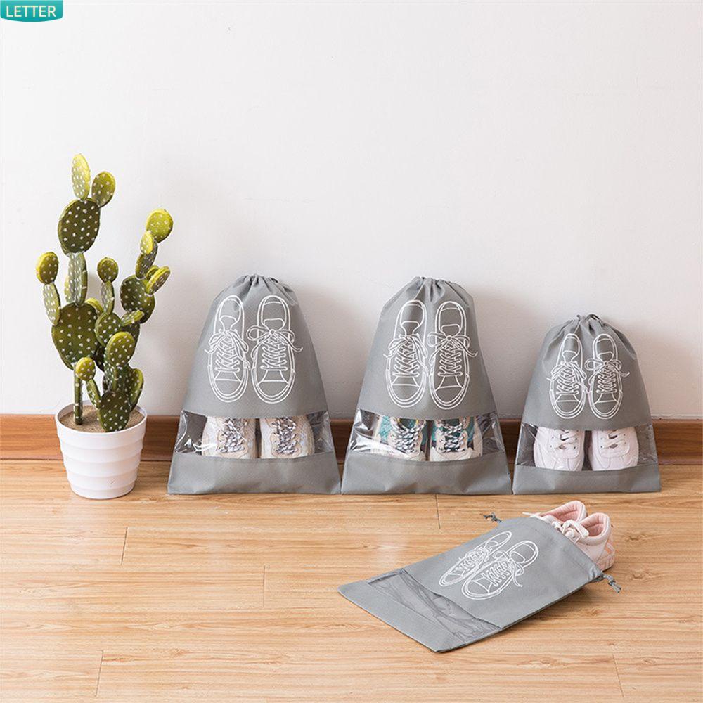 Túi Đựng Giày Mang Đi Du Lịch Chất Liệu Vải Không Dệt Dày Dặn Có Dây Rút Gọn Nhẹ Nhiều Màu Sắc