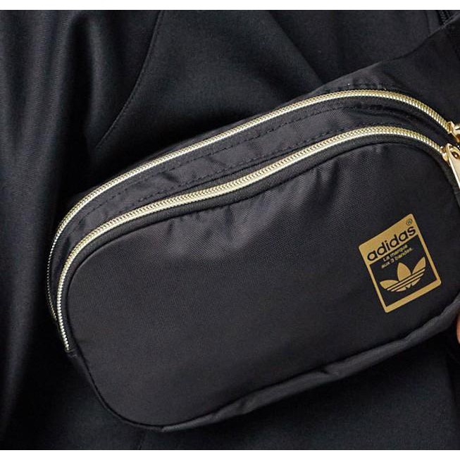 (THAILAND XUẤT XỊN) Túi bao tử das đen logo vàng, khóa vàng Adidas Originals Superstar Waist Bag Black/Gold GF3200