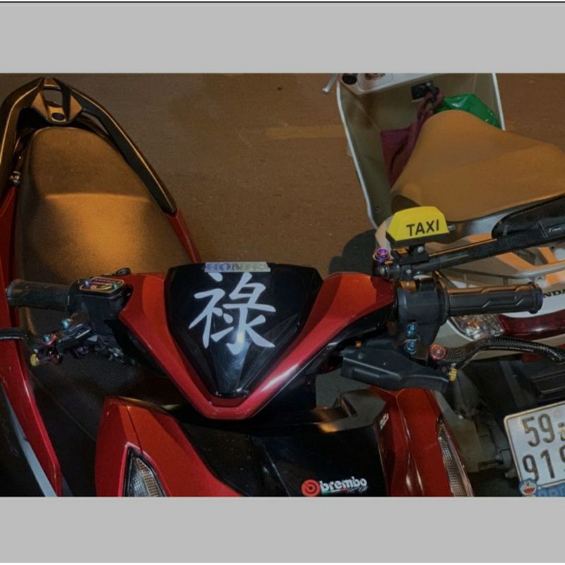 Tem chữ tàu dán xe máy