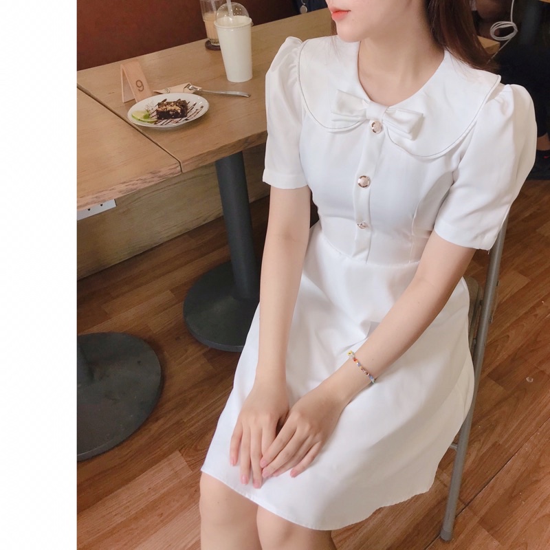 Đầm nơ viền chỉ