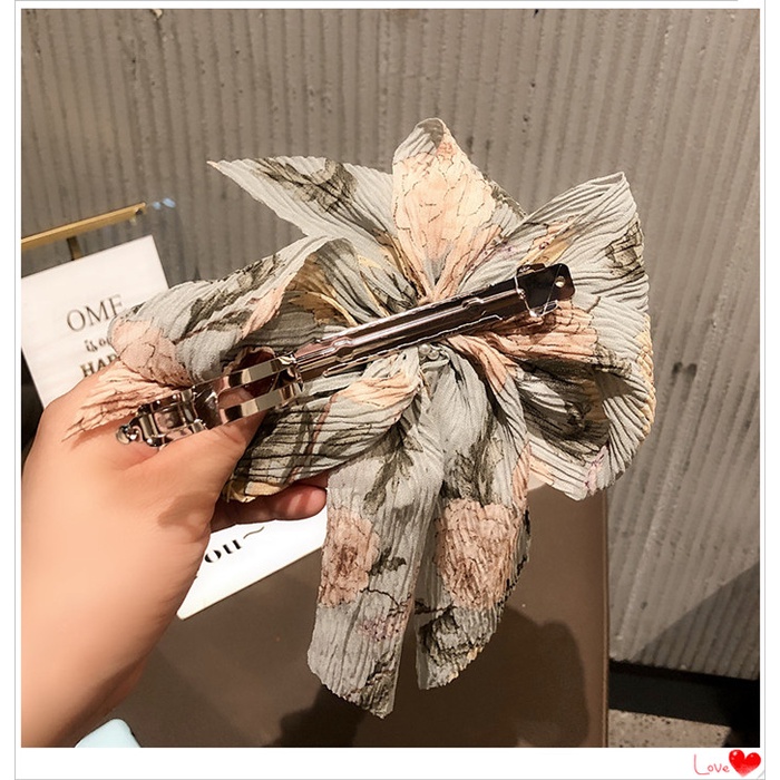 Kẹp tóc hình nơ đính hạt ngọc trai phong cách Hàn Quốc