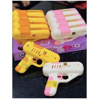 Súng bắn kẹo kèm kẹo mút