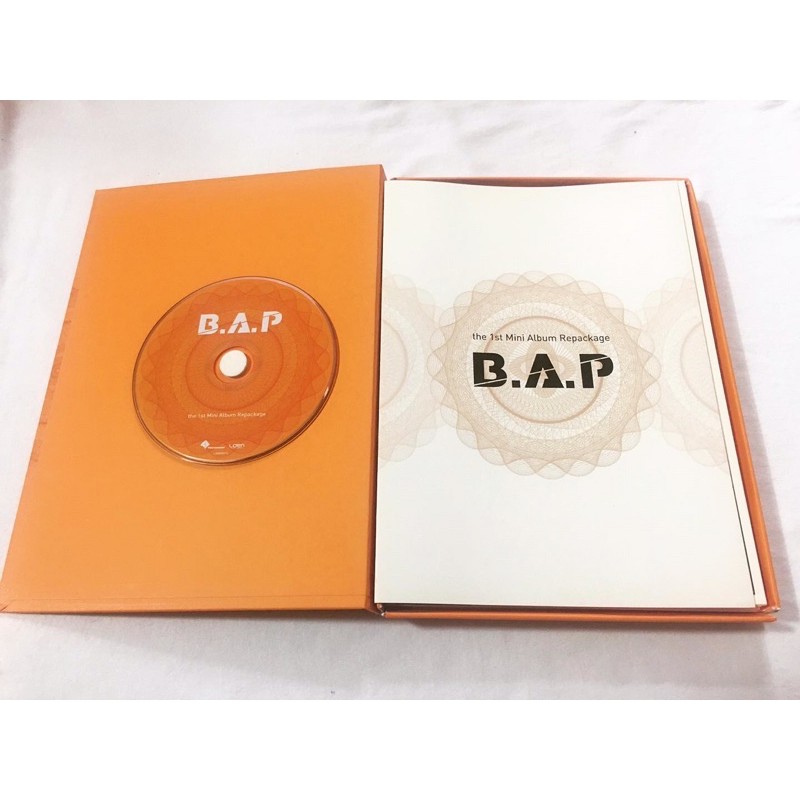 B.A.P 1st repackage Album đã khui seal, gồm cd và photobook rời như hình.