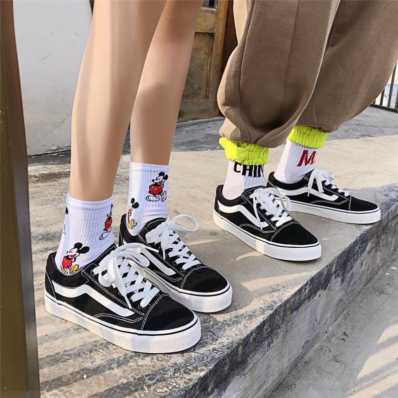 Trang web chính thức cửa hàng đầu của Tian Xin Wansi giày nam thấp cổ điển và nữ màu đen vải đôi trượt ván