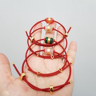 Vòng tay lu thống dây cước đỏ đá mạ vàng