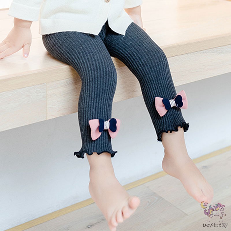 Quần legging phối nơ phong cách thời trang tinh tế cho bé gái