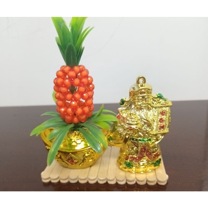Tượng ông Thần Tài thỏi vàng trái thơm kích hoạt may mắn tài lộc